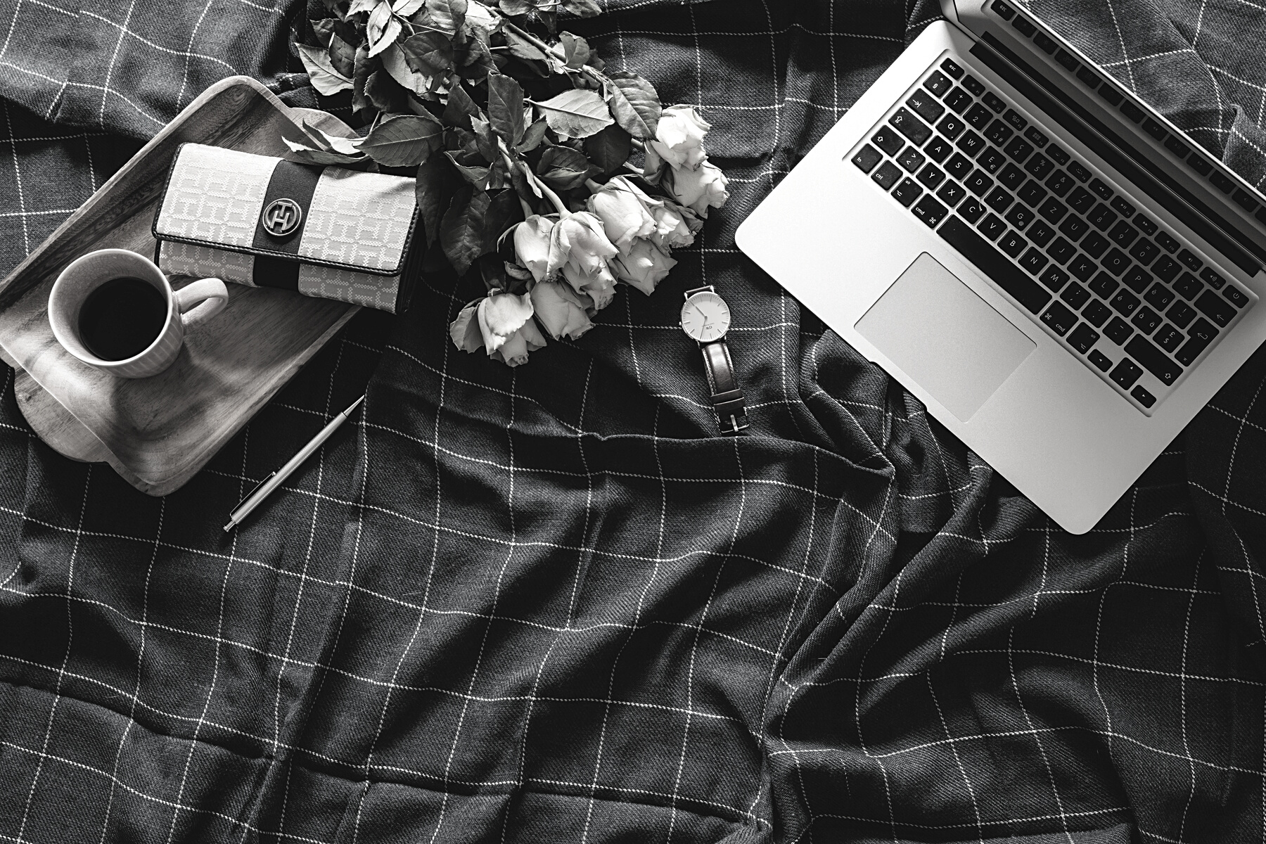 Flat Lay Photography of Laptop Beside Yellow Flower Arrangement